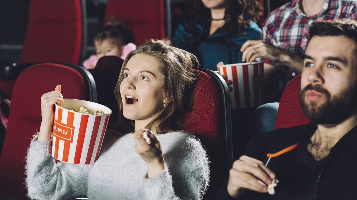 excited woman watching movie cinema