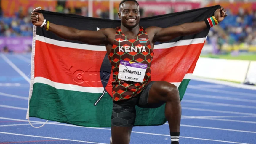 Sprinter Ferdinand Omanyala celebrates with the Kenyan sprinter Ferdinand Omanyala celebrates with the flag after winning Gold in 100m final at Commonwelath Games og image